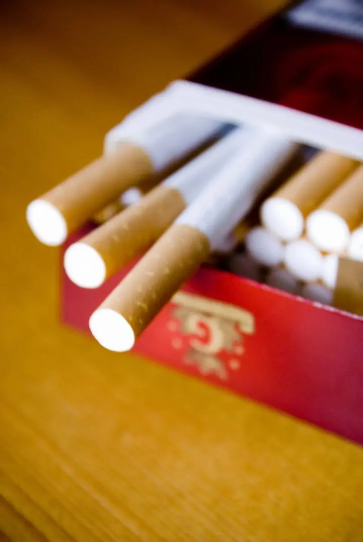 A close up of cigarettes in an open box