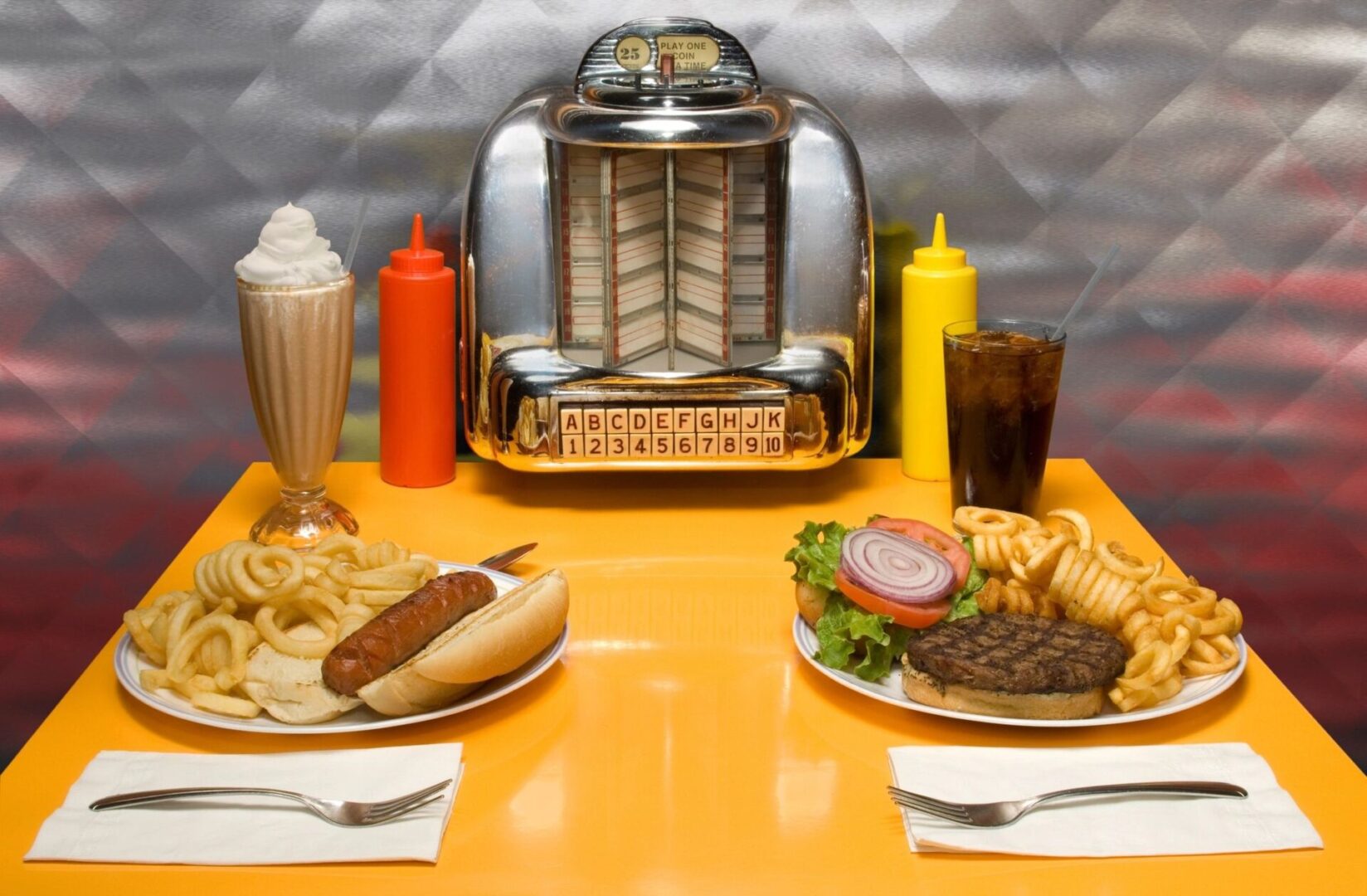 A table with two plates of food and a machine.